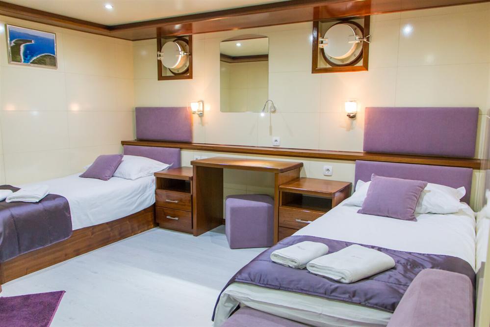 Futura-luxury-ship-single-beds-room